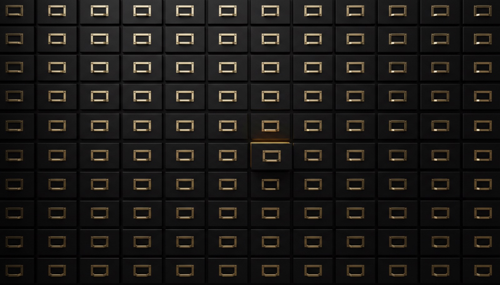A wall of dark archive drawers with brass handles, one drawer open and lit from inside.